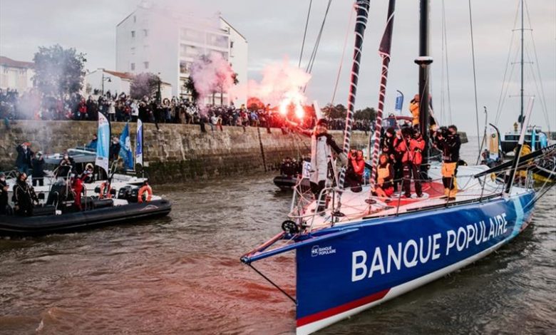 skipper Clarisse Cremer, Banque Populaire X, is pictured celebrating with flares in the channel during arrival of the Vendee Globe sailing race, on February 2 - photo © Jean-Louis Carli / Alea